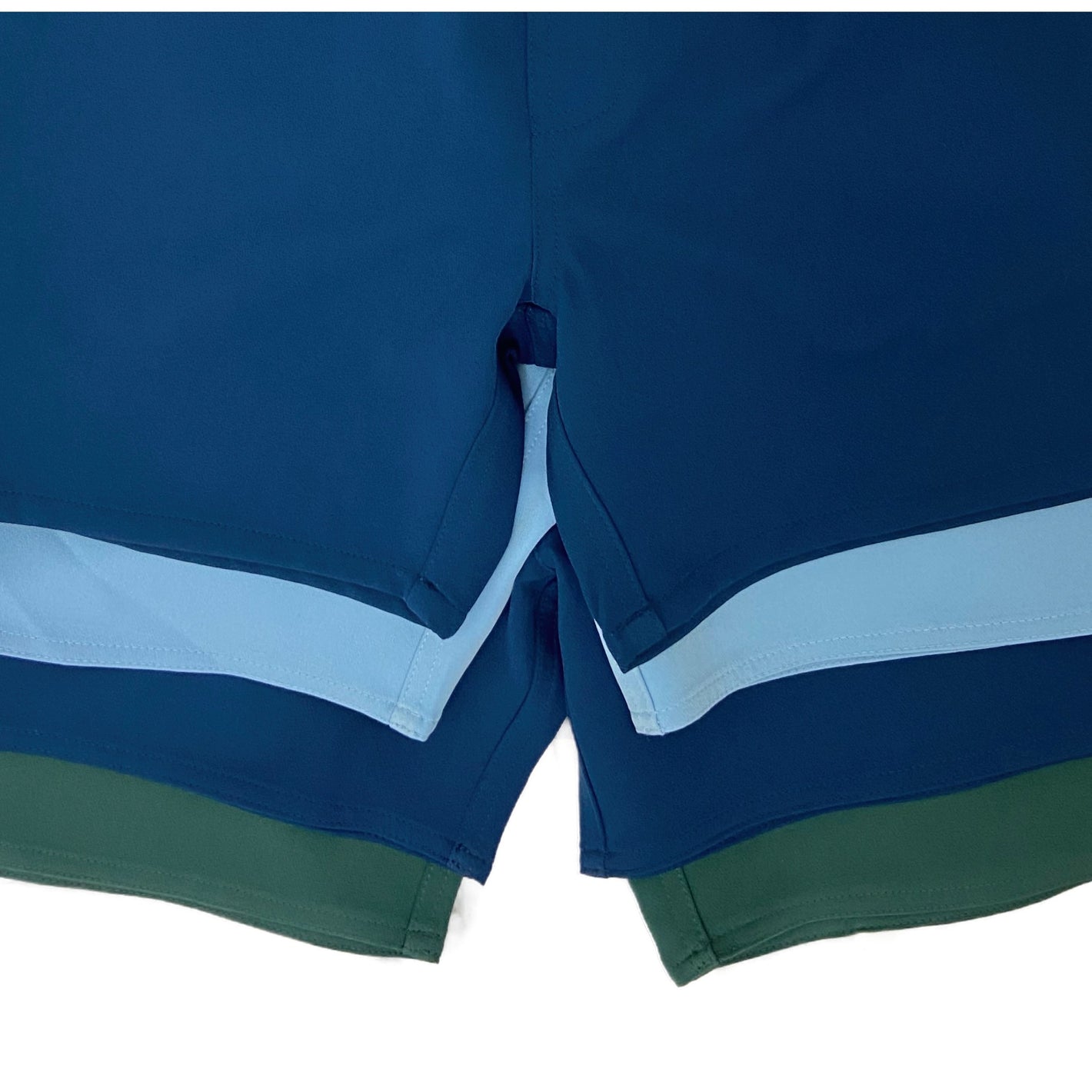 four swim suits of different outseam lengths stacked on top of each other